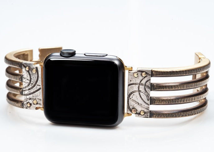 Jaffa Bridge Apple Watch band with Silver. A heavy-duty, solid brass, forked band trimmed with contrasting sterling silver trim embossed with spirals.