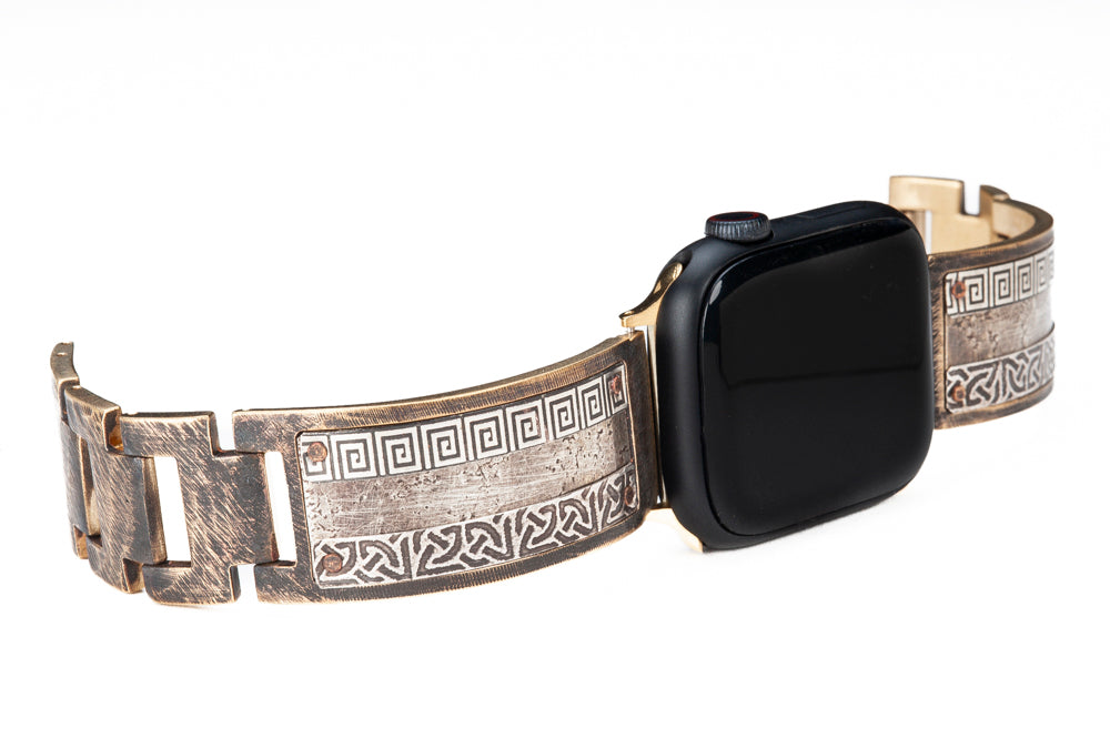 Our bestselling sterling silver Apple watch band, shown here in a wide band. Slices of sterling silver are embossed with Celtic and Greek designs and then riveted by hand onto a solid metal band. Bard sterling silver iWatch facing to the right.