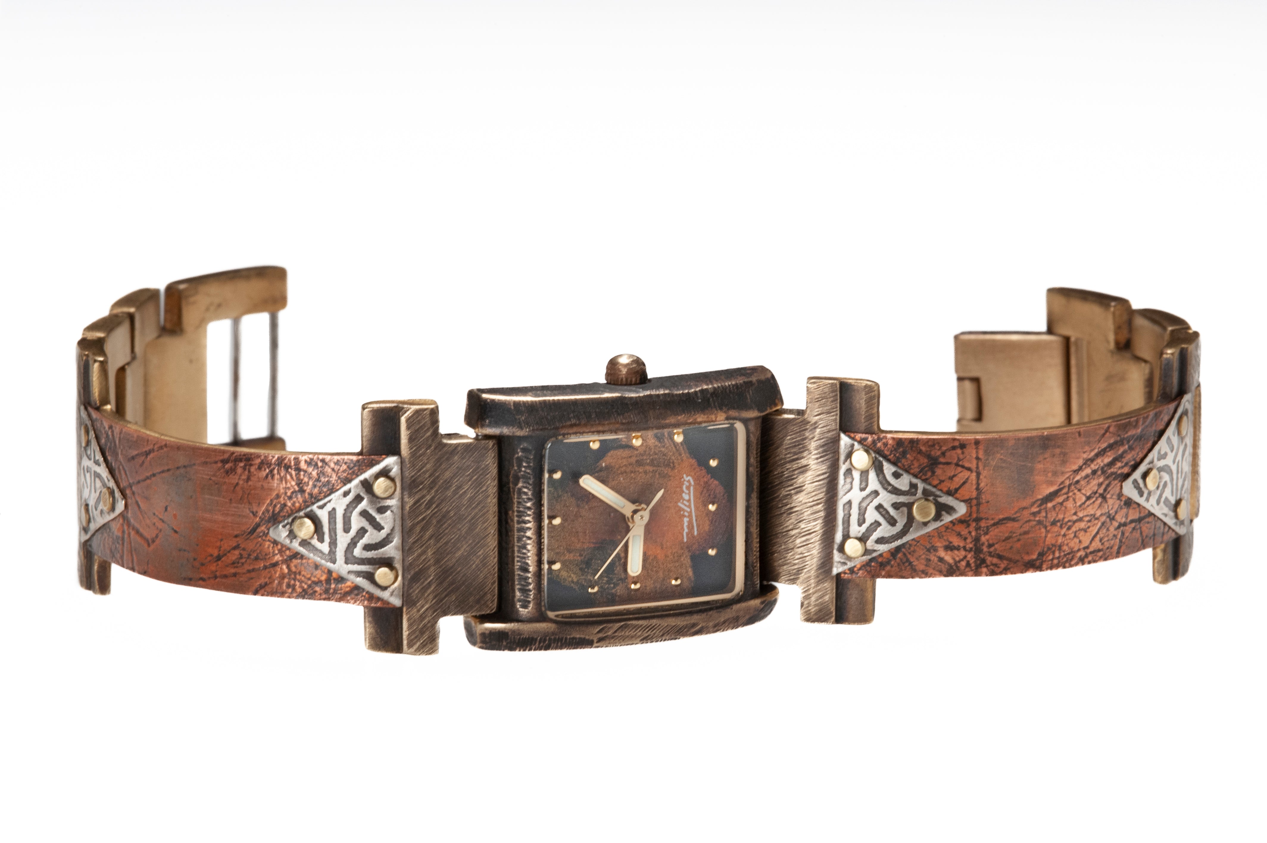 The Ponte Vecchio watch in copper and silver, facing front. Note the domed glass that marks the FLORENCE collection. The silver triangles are embossed with Celtic designs while the copper watch band bears the patterns of handmade coconut paper pressed onto the metal.