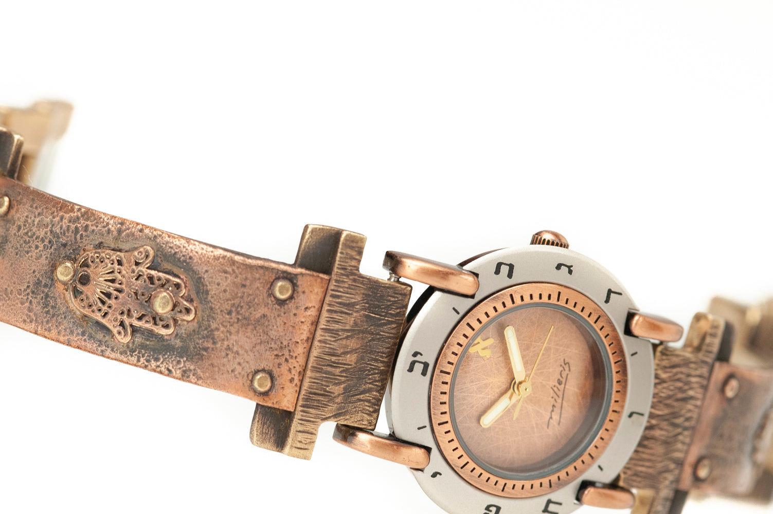 Close-up of brushed copper dial with Hebrew numerals on handcrafted copper watch – ALEPH Hamsa