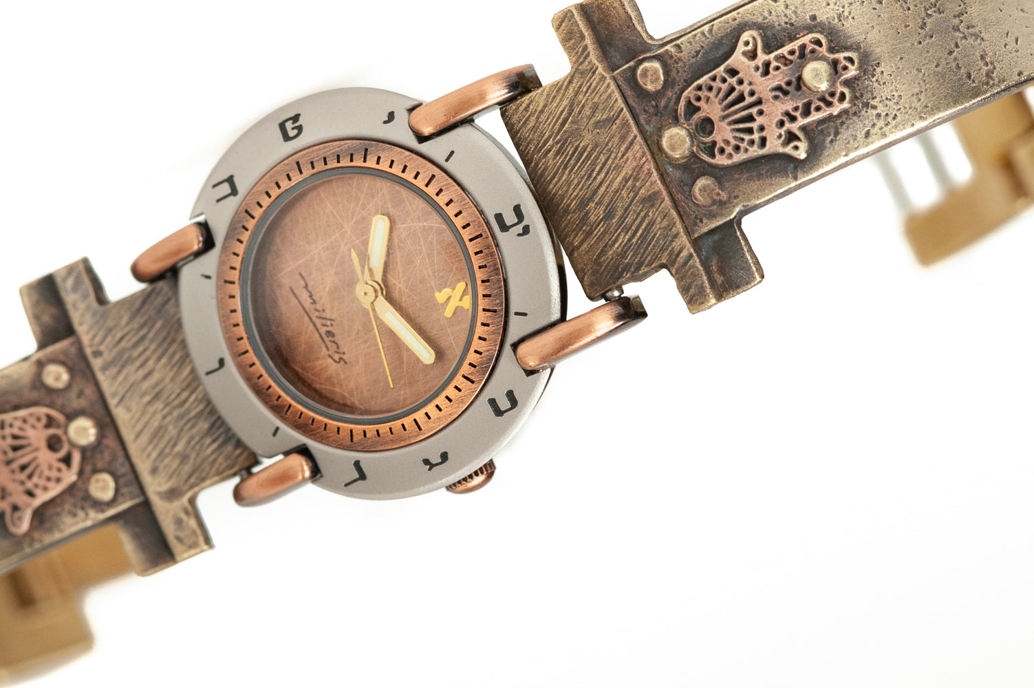 Close-up of brushed copper dial with Hebrew numerals on handcrafted watch – ALEPH Hamsa