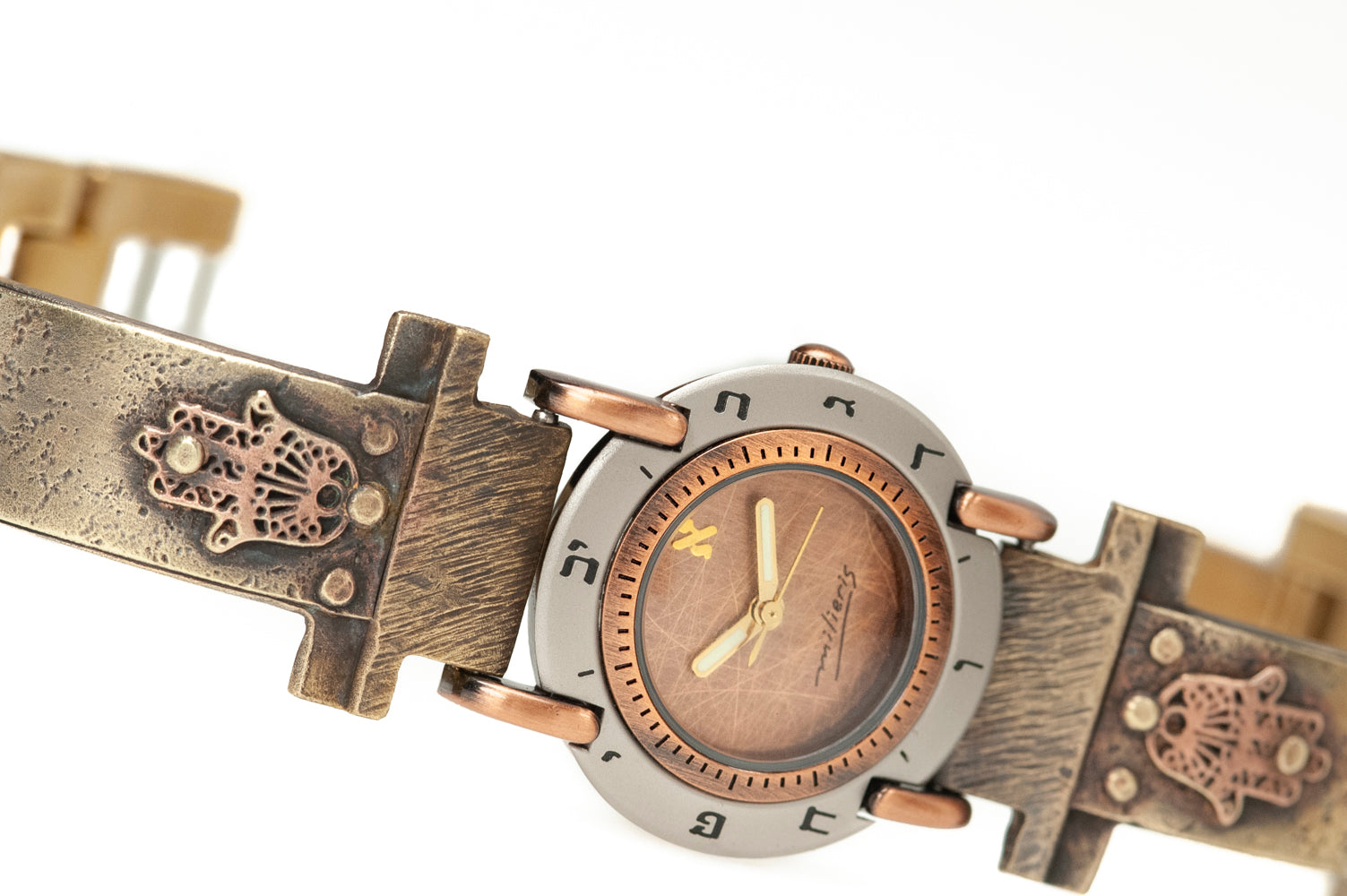 Close-up of hamsa talisman and brushed copper dial with Hebrew numerals - ALEPH Hamsa