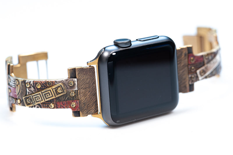 The Golan Apple Watch band has a narrow band, hand-riveted with a mosaic of silver, copper and brass. A truly unique design. 